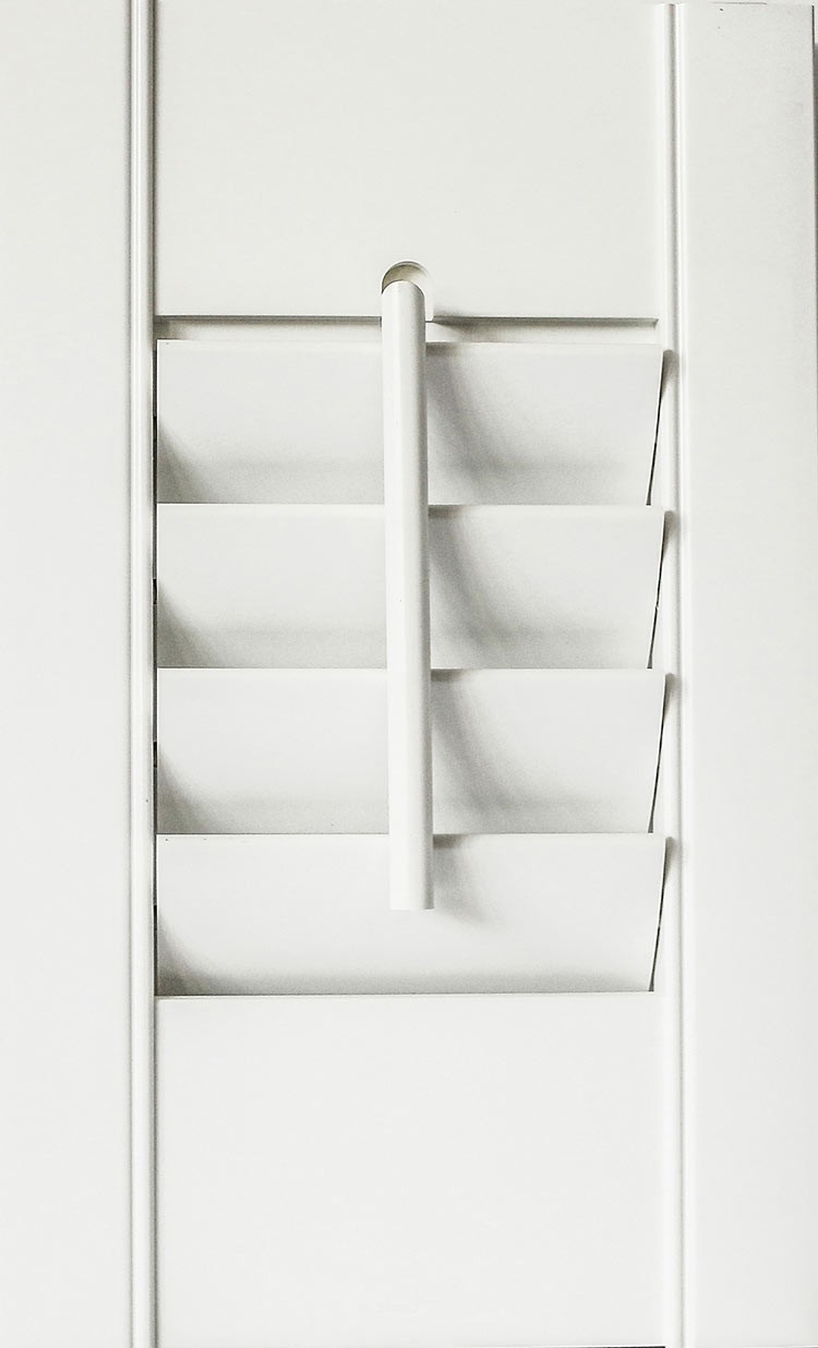 Shutters with decorative tilt rods