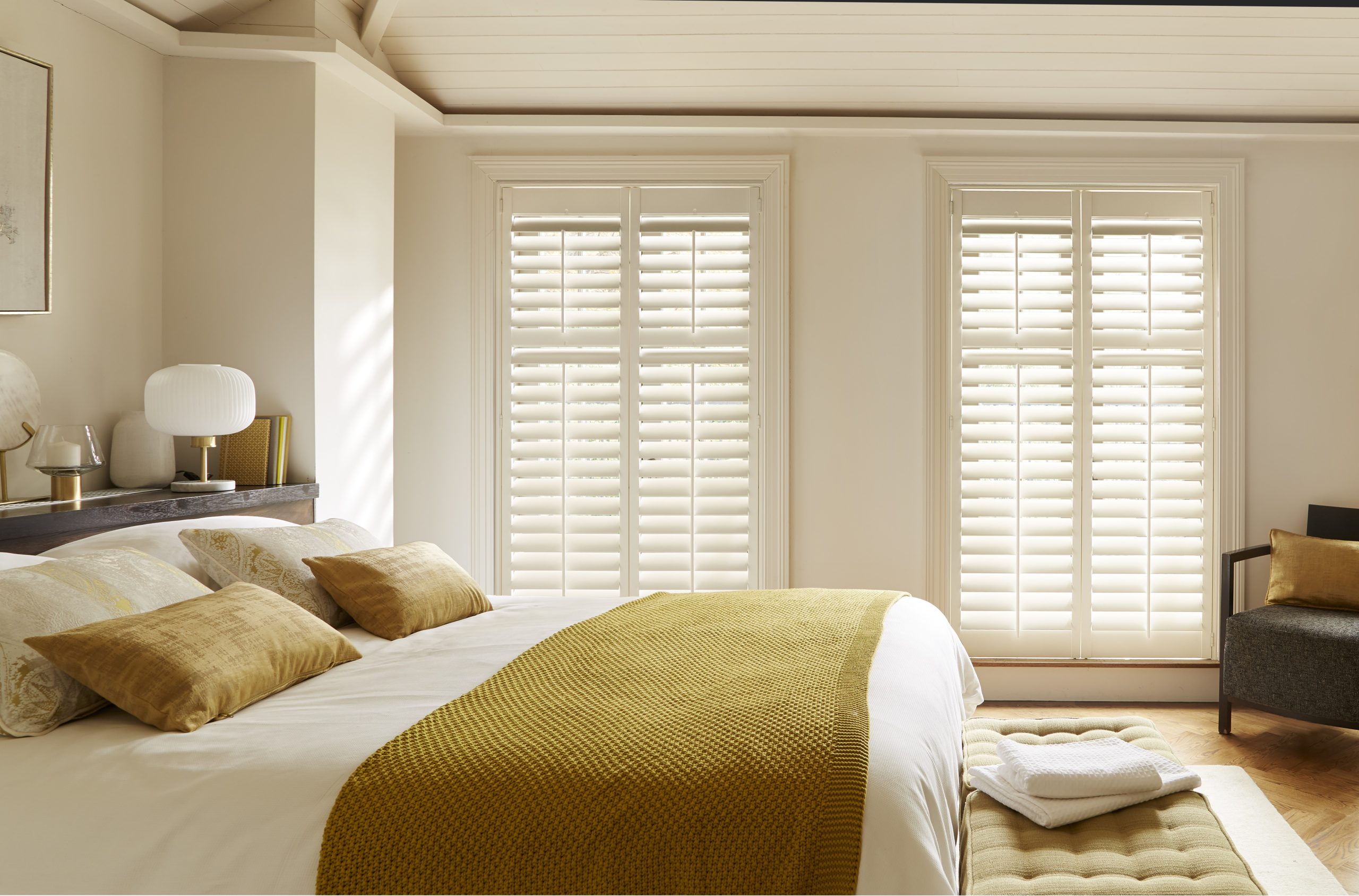 Warm living room with bay shutters