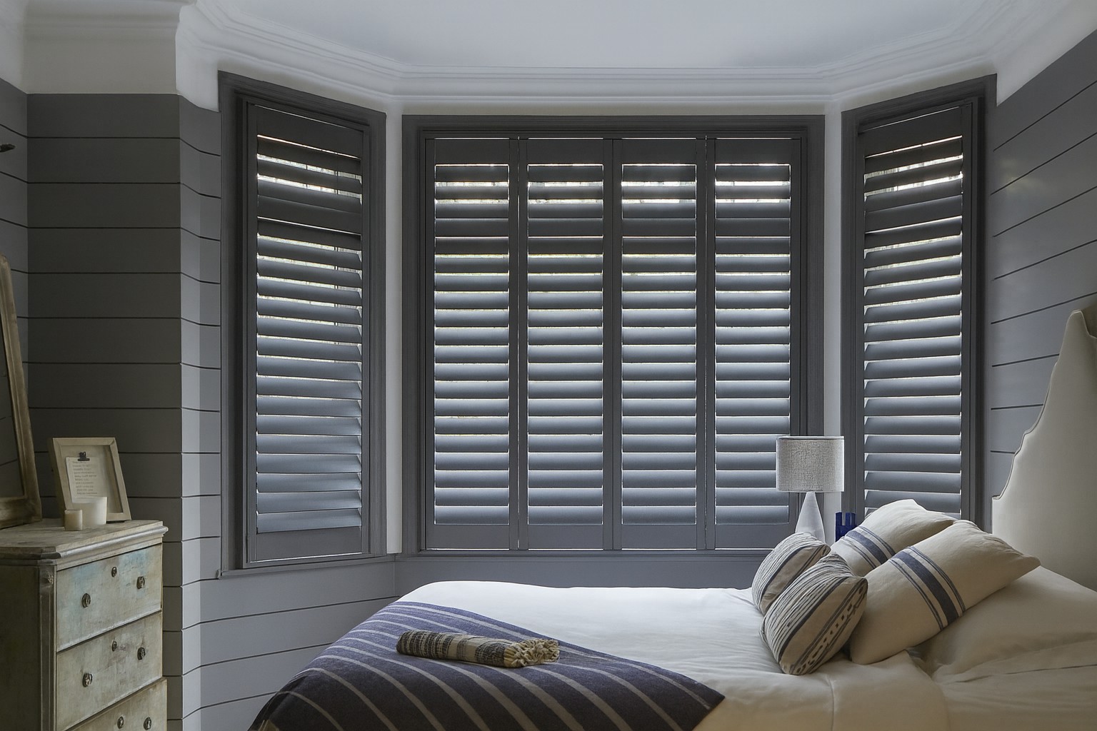 Warm living room with bay shutters